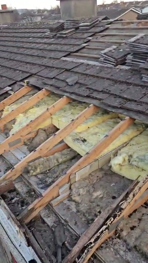 Damaged roof → Repaired roof — before photo of roofing work by Mikey & Sons