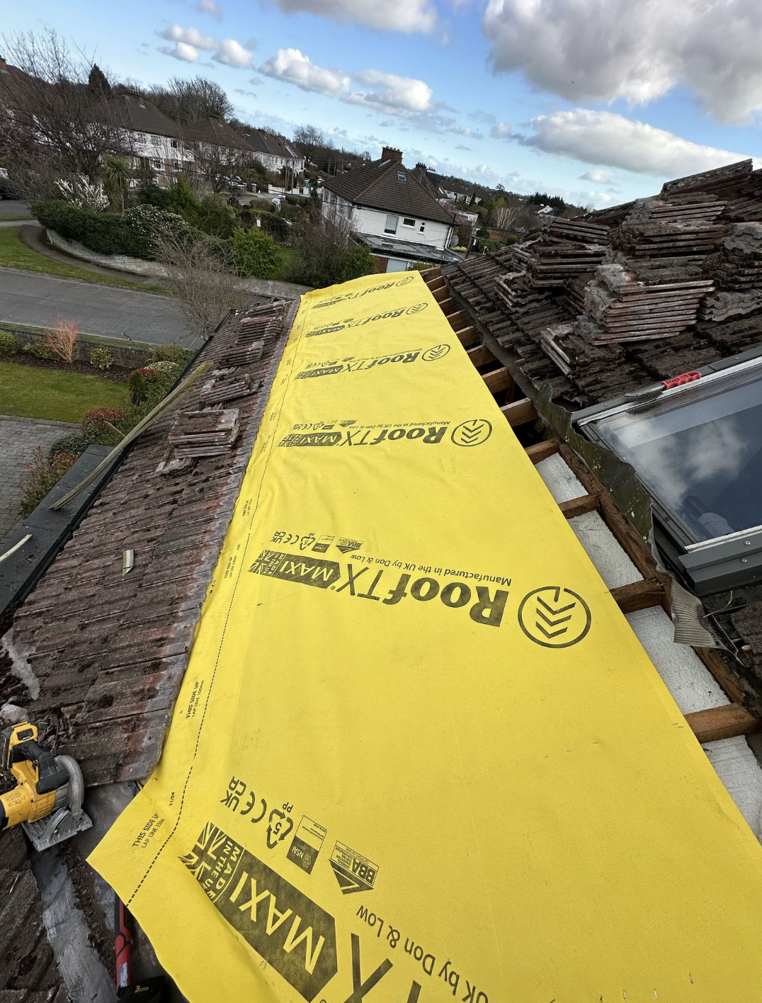 Tiles stripped, new membrane going on — roofing work in Dublin